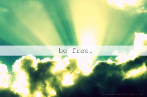 the words Be free over a cloud covering the sun
